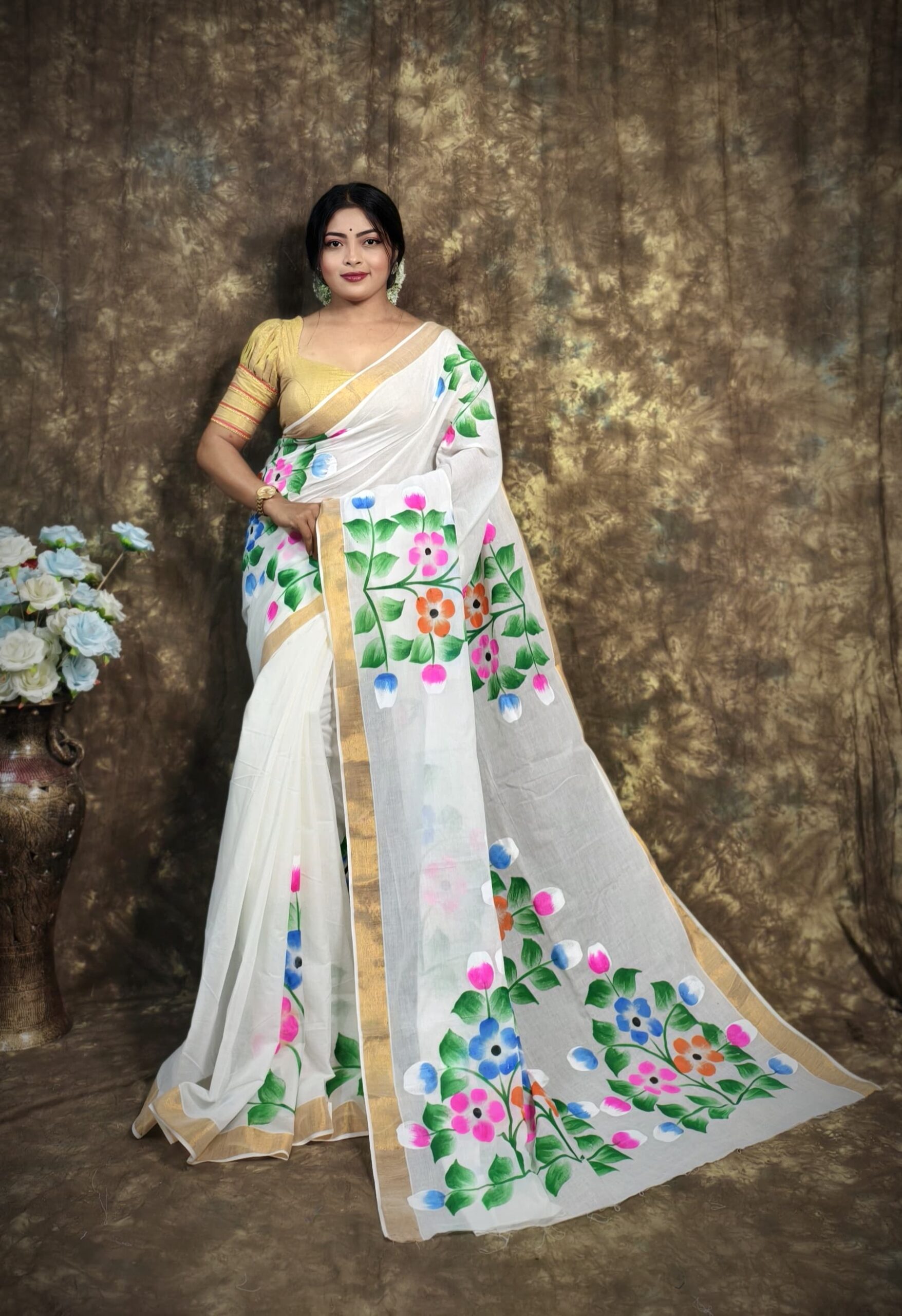 Floral Radiance: White Kerala Cotton Saree with Hand-Painted Art & Golden Border