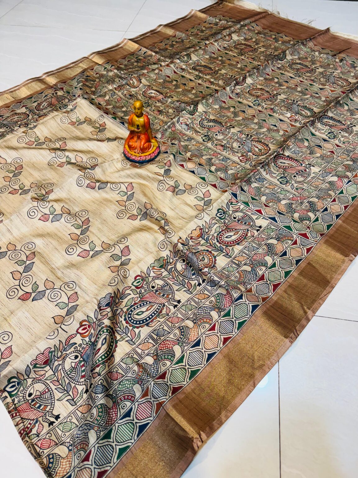 Handcrafted Tussar Silk Saree with Madhubani-Inspired Birds & Floral Vines – Beige with Bronze Elegance