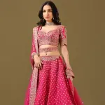 SEASONS-RANI PINK CLASSIC BRIDAL LEHENGA SET WITH ALL OVER PATTERNED HAND EMBROIDERY PAIRED WITH A MATCHING DUPATTA AND FLORAL EMBROIDERED DETAILS.