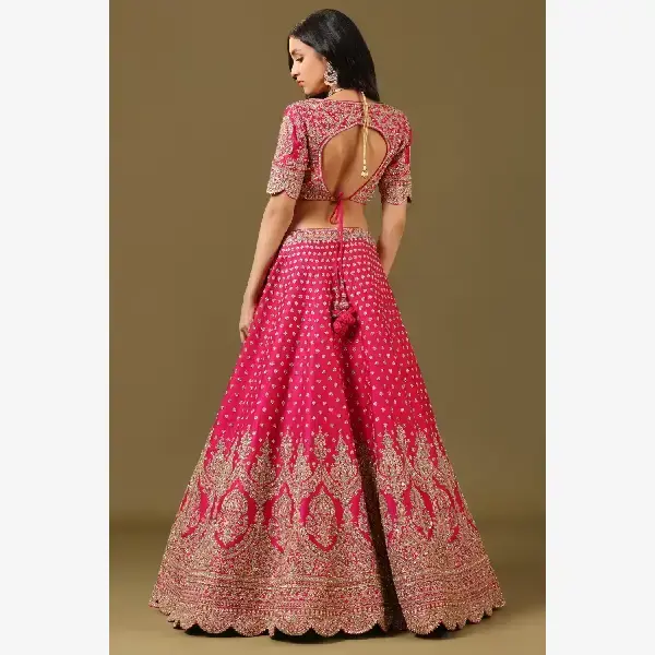 SEASONS-RANI PINK CLASSIC BRIDAL LEHENGA SET WITH ALL OVER PATTERNED HAND EMBROIDERY PAIRED WITH A MATCHING DUPATTA AND FLORAL EMBROIDERED DETAILS.