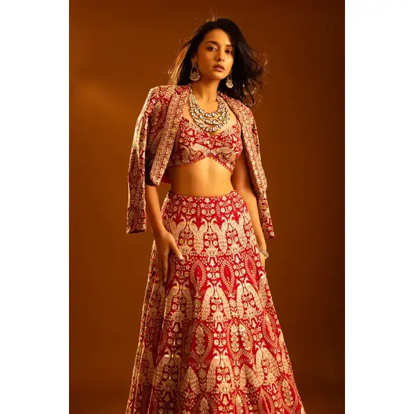 SEASONS-RED CLASSIC BRIDAL LEHENGA SET WITH ALL OVER PATTERNED THREAD WORK PAIRED WITH A MATCHING CROPPED JACKET AND SEQUIN DETAILS.